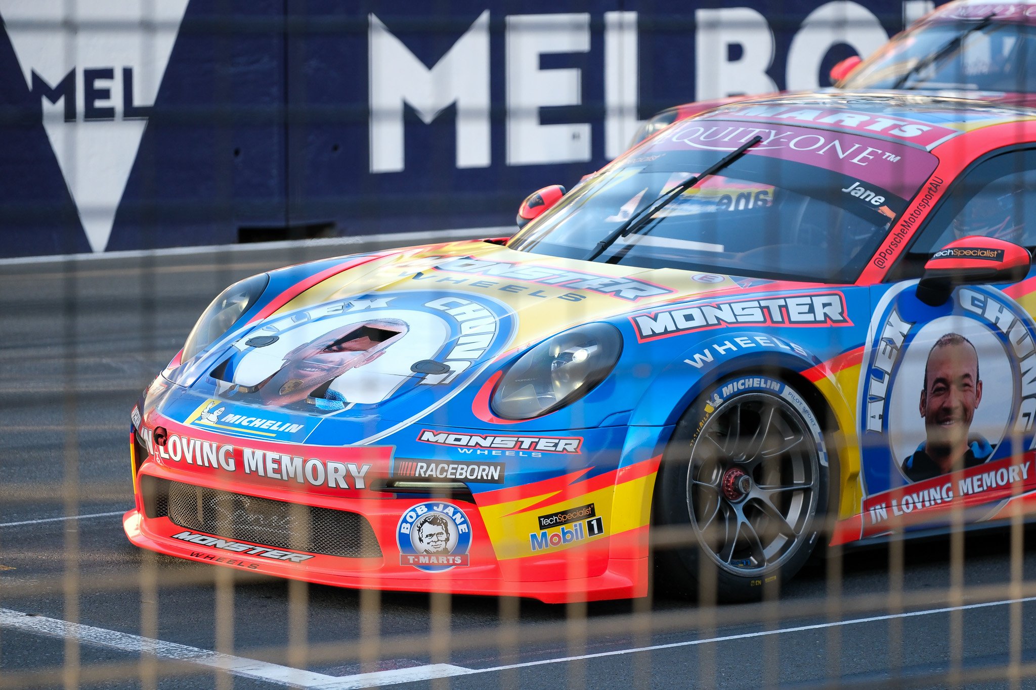 Race car driving past at a Supercars event